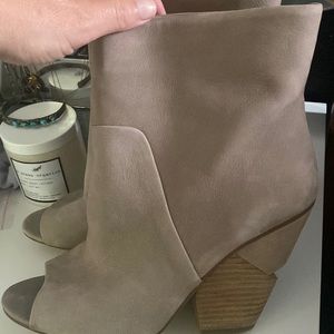 New never worn , notched leather bootie
